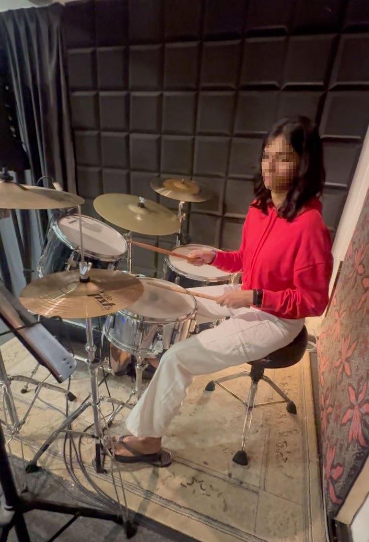 Female Playing Drums