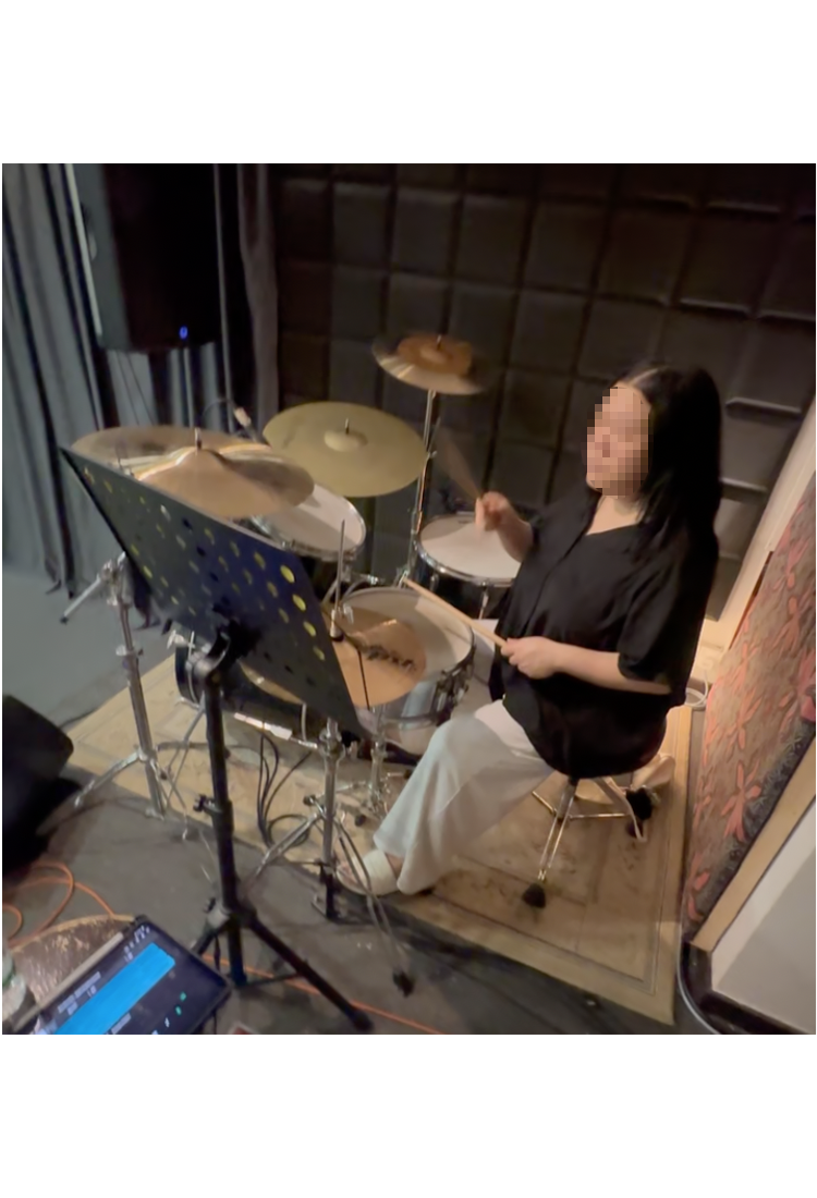 Female Playing Drums